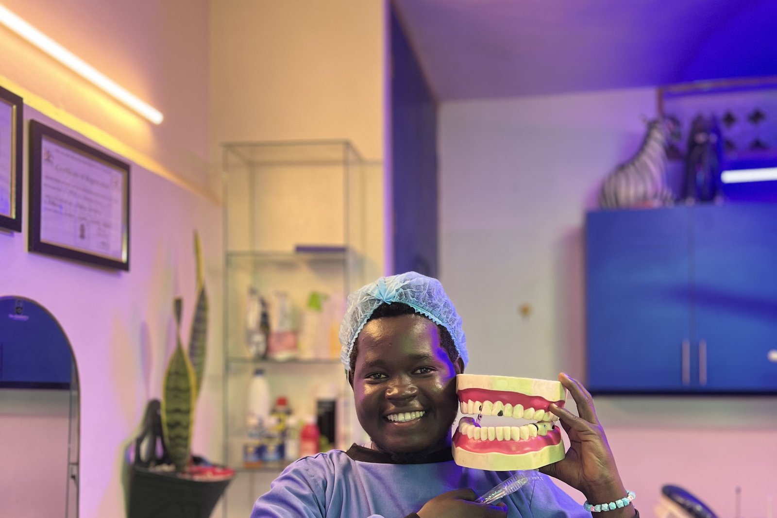 The Dental Man (Geofrey) teaching dental anatomy at Piwan Dental, Gulu